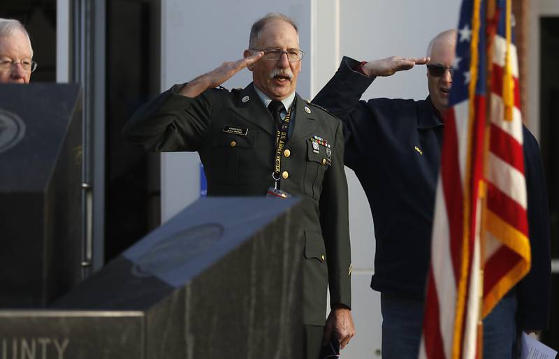 Veteran Carl Kamlenski helps lead the “Pledge of Allegiance” during the “Voices from Vietnam,” program on Friday, March 29, 2024, at the McHenry County Government Administration Building in Woodstock. The program was the first time that McHenry County honored Vietnam veterans on Vietnam War Veterans Day. The day, that was created by federal law enacted in 2017, honors the more than 2.7 million American men and women who served in Vietnam.