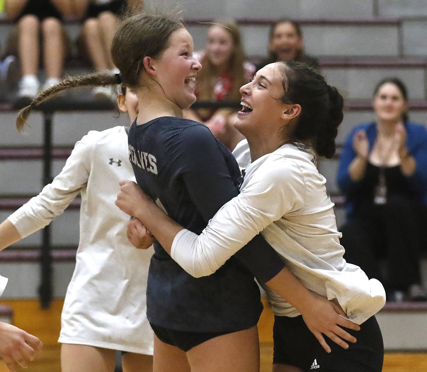 Prairie Ridge's Tegan Vrbancic and her teammate, Maizy Agnello, celebrate a point during a Fox Valley Conference volleyball match against Crystal Lake South Thursday, Aug. 24, 2023, at Prairie Ridge High School.