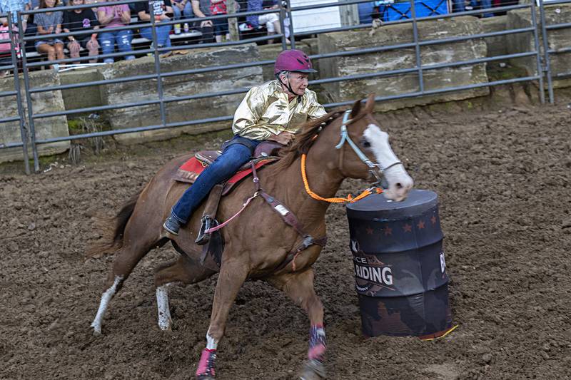 Ellen Inman, a 1966 Lanark graduate, competes in the Rice Bull Riding and Barrel Racing event Thursday, August 11, 2023 at the Carroll County fair.