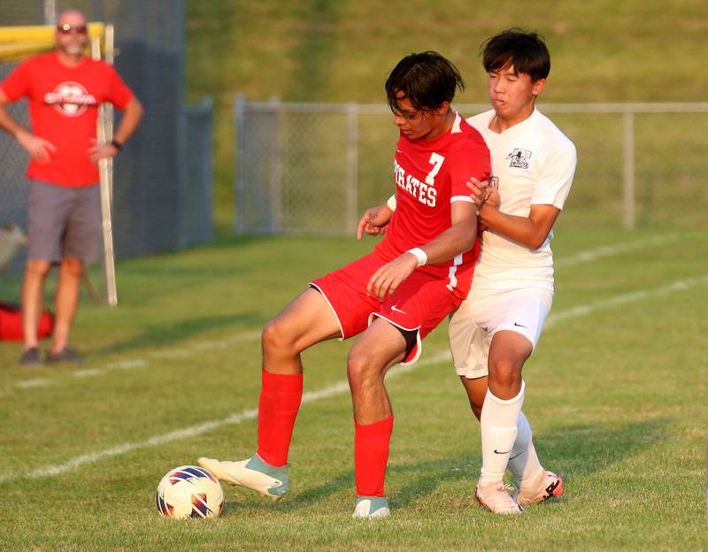 Ottawa's Jeorge Lopez keeps the ball away from Kaneland's Vu Do on Wednesday, Sept. 11, 2024 at King Field.