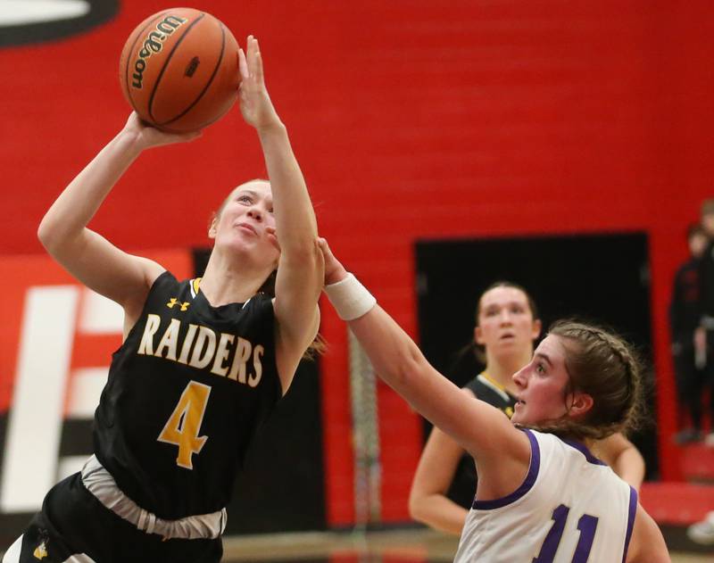 Ashton-Franklin Center's Reese Polk eyes the hoop as Serena's Rayella Brennan defends during the Class 1A Regional final on Thursday, Feb. 15, 2024 at Earlville High School.