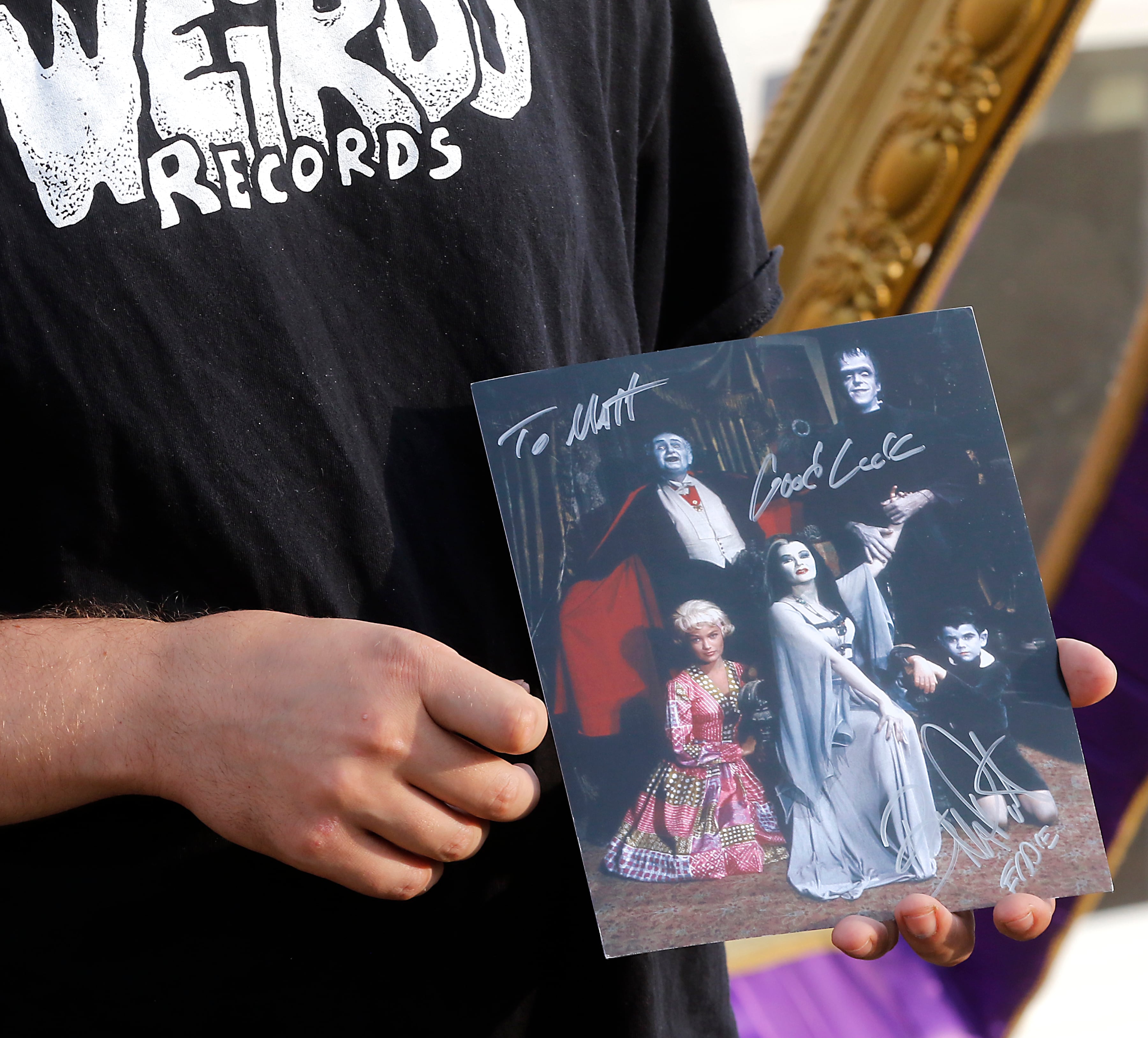 A fan holds a Butch Patrick autograph during an appearance by Patrick, who played Eddie Munster on the 1960s show “The Munsters” on  Wednesday, Aug. 14, 2024,  at the McHenry Outdoor Theater.