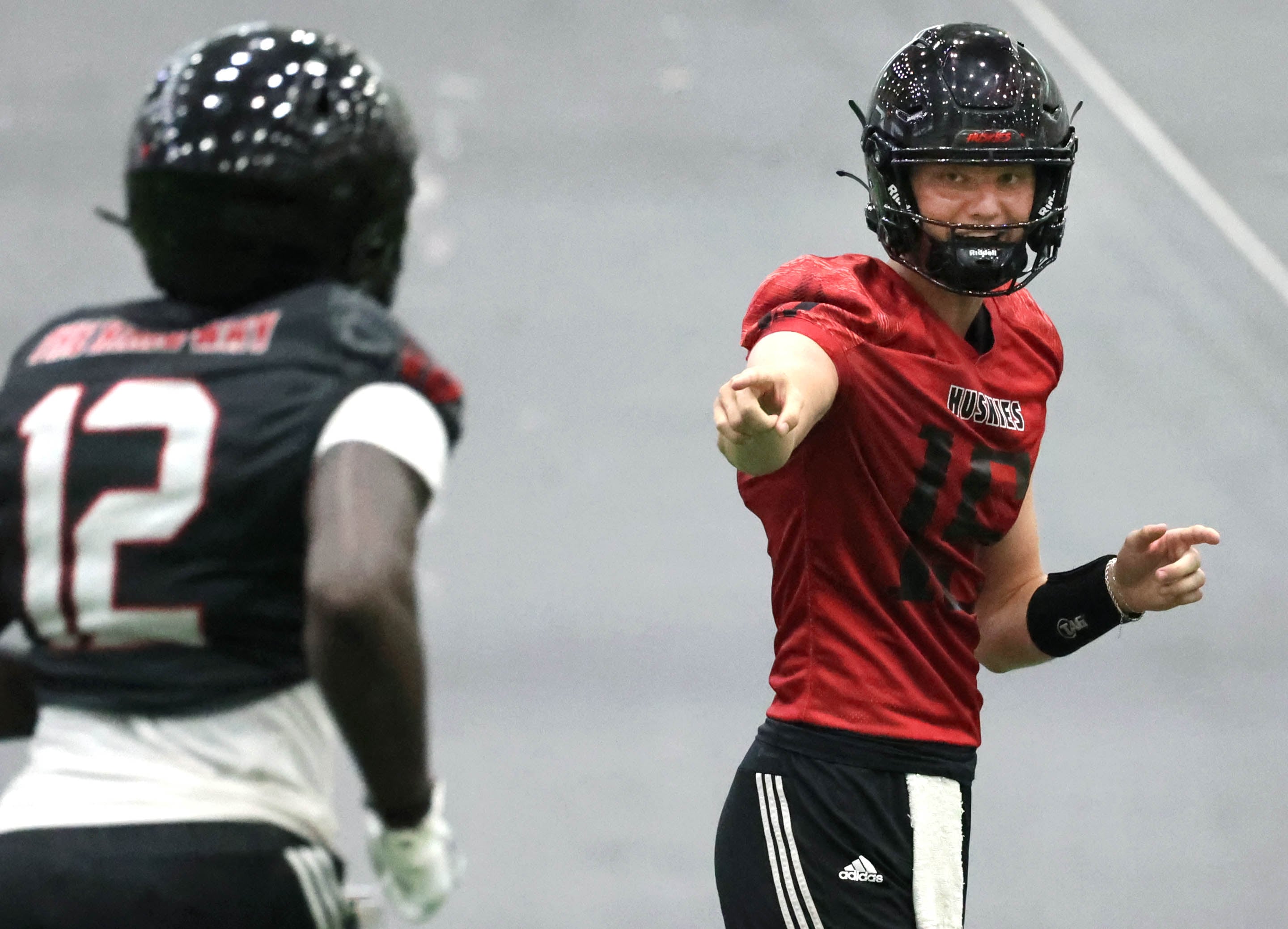 Northern Illinois University quarterback Josh Holst gets the offense set up before the snap Wednesday, July 31, 2024, during practice in the Chessick Practice Center at NIU.