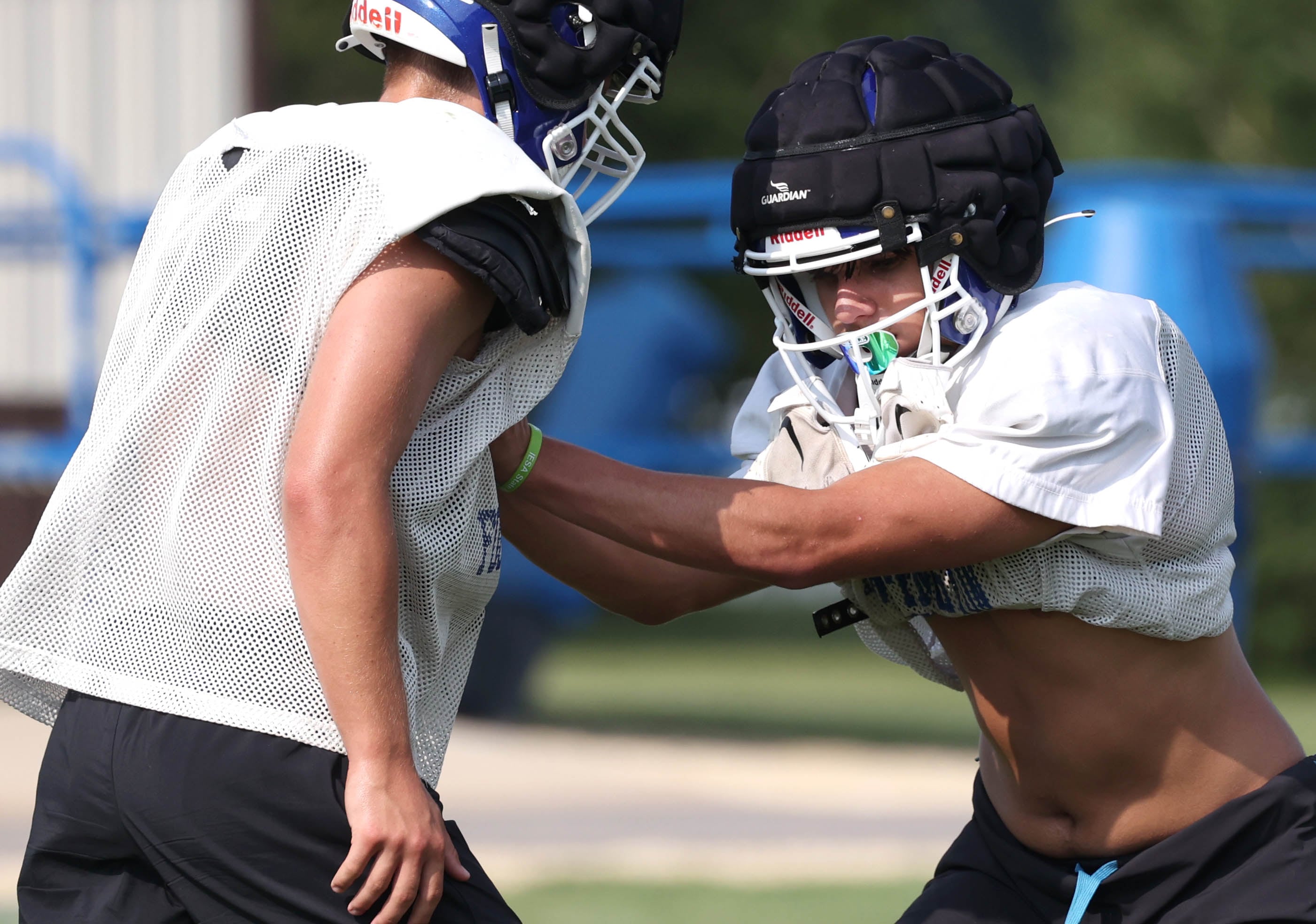 Genoa-Kingston’s Tyler Atterberry (right) works on a defensive drill during practice Wednesday, Aug. 14, 2024, at the school in Genoa.