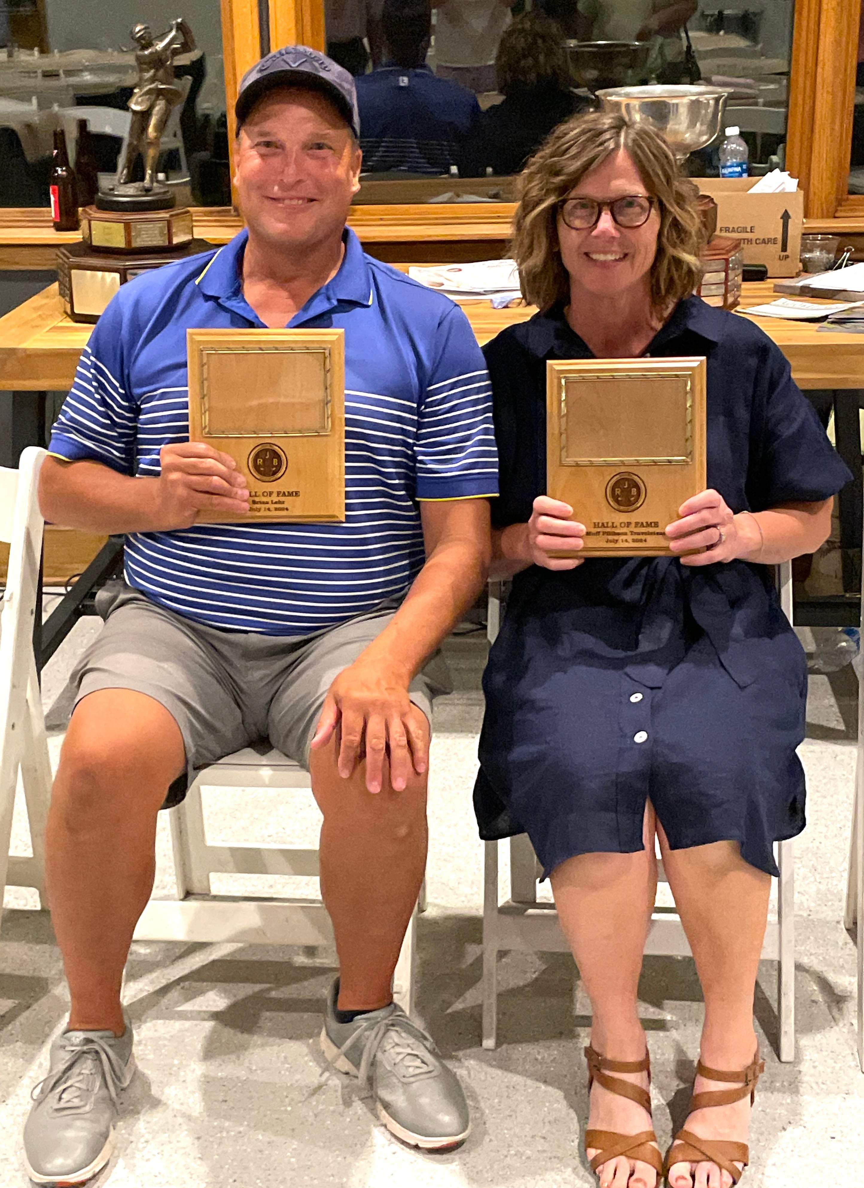 Brian Lehr, at left, and Muff Travelstead Pflibsen were inducted Sunday into the Richard J. Berry Memorial Golf Association Hall of Fame.