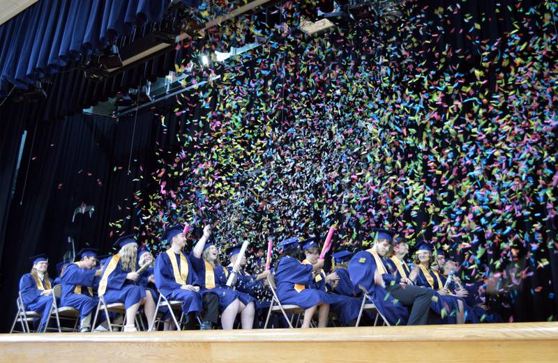 Members of the Polo Community High School Class of 2024 shoot confetti into the air at the end of their commencement ceremony on Sunday, May 19, 2024.