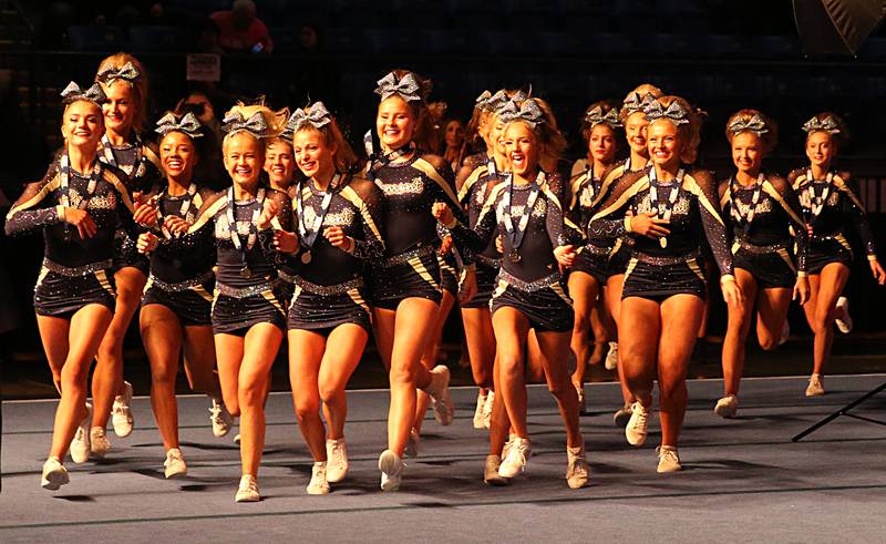 Members of the Lemont cheer team receive their second place trophy during the IHSA Cheer State Finals in Grossinger Motors Arena on Saturday, Feb. 4, 2023 in Bloomington.