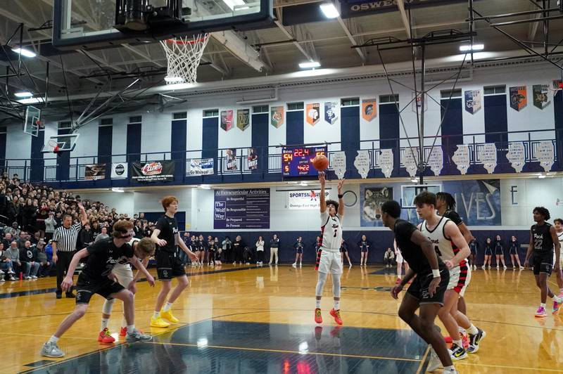 Benet’s Jayden Wright (3) shoots a free throw late in the fourth quarter of play against Oswego East during a Class 4A Oswego East regional final basketball game at Oswego East High School on Friday, Feb 23, 2024.