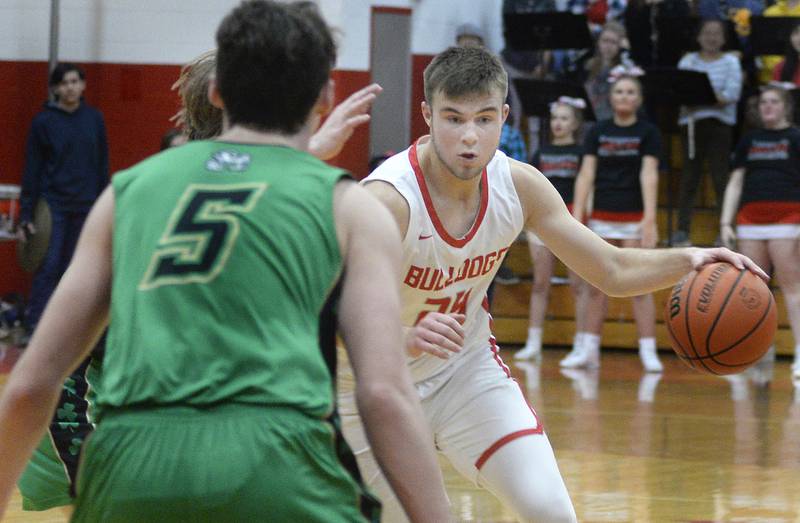 Streator’s Landon Muntz works to go around Seneca’s Kysen Klinker in the 2nd period in Pops Dale Gymnasium on Tuesday Feb. 7, 2023 at Streator High School.