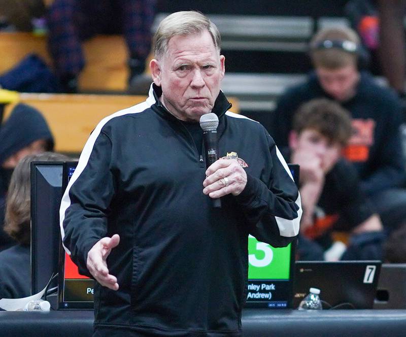 Former Batavia wrestling coach Tom Arlis speaks to the crowd about his late son Clint Arlis to whom the invitational is named after and the history of Batavia Wrestling during The Clint Arlis Invitational Wrestling meet at Batavia High School in Batavia on Saturday, Jan 13, 2024.