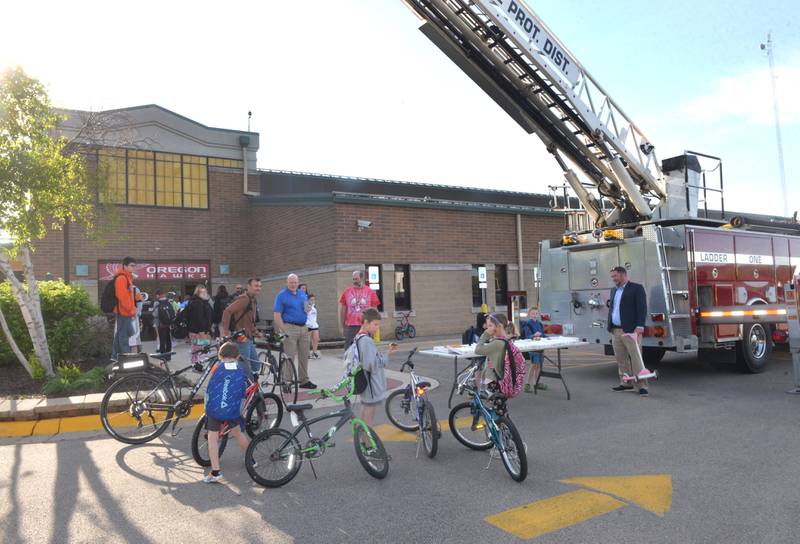 Kids rode  their bikes  to school at the Oregon School District's Bike & Roll Day on Wednesday, May 8, 2024. The event was made possible through a joint effort by the school district and the Oregon police and fire departments.