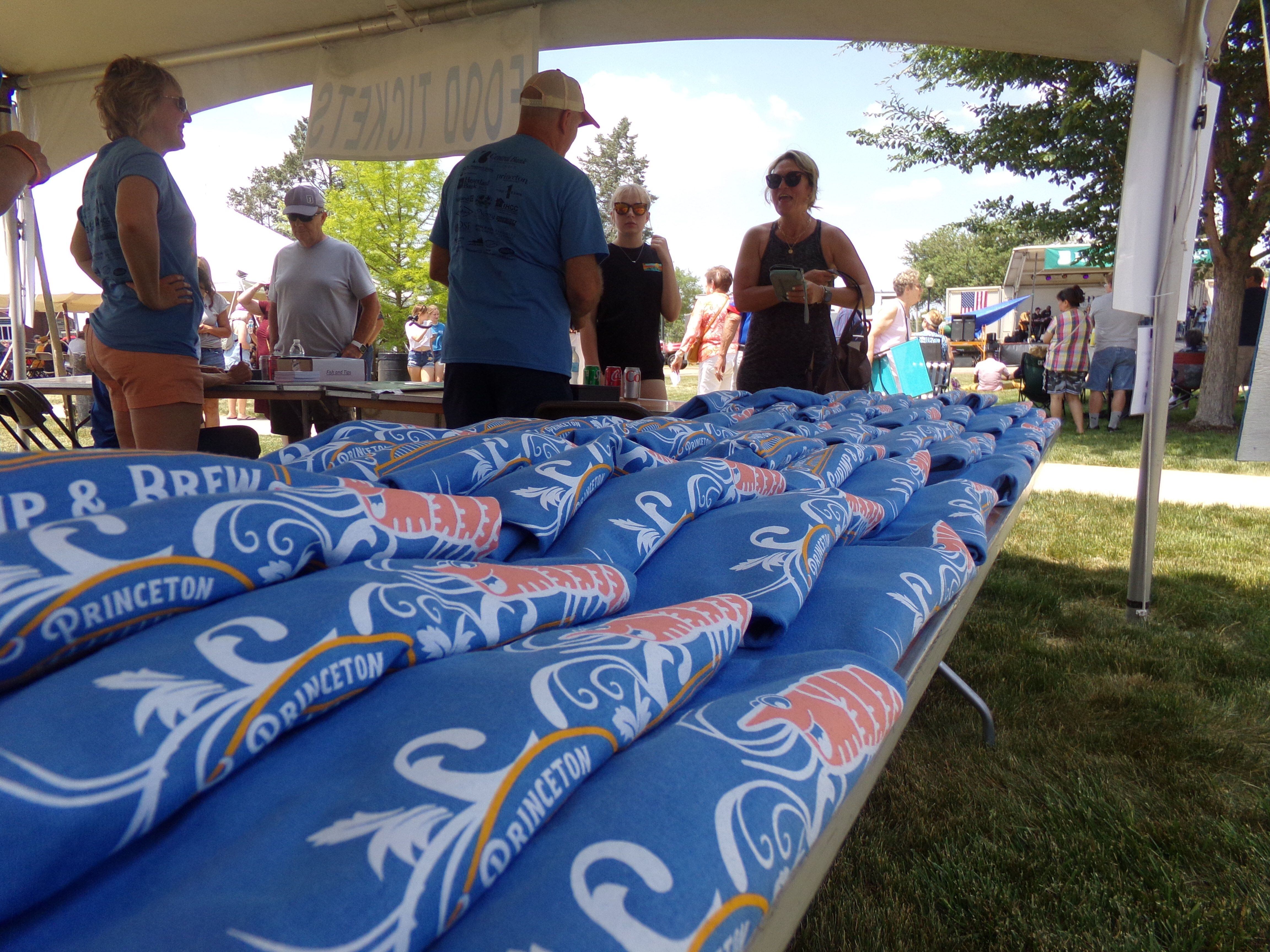 Themed T-shirts were sold Saturday, June 3, 2023, for the Shrimp and Brew Hullabaloo at Rotary Park in Princeton.