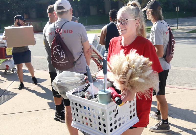 Incoming Northern Illinois University freshman Zoe Hougas moves into New Residence Hall Thursday, Aug. 19, 2022, at NIU. Thursday was one of four move-in days for students attending the upcoming school year.