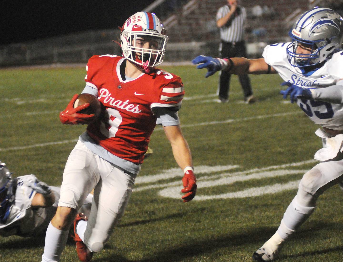 Ottawa's Levin Sheehan (3) evades Woodstock's Adriane Perry at King Field on Friday, Oct. 21, 2022.