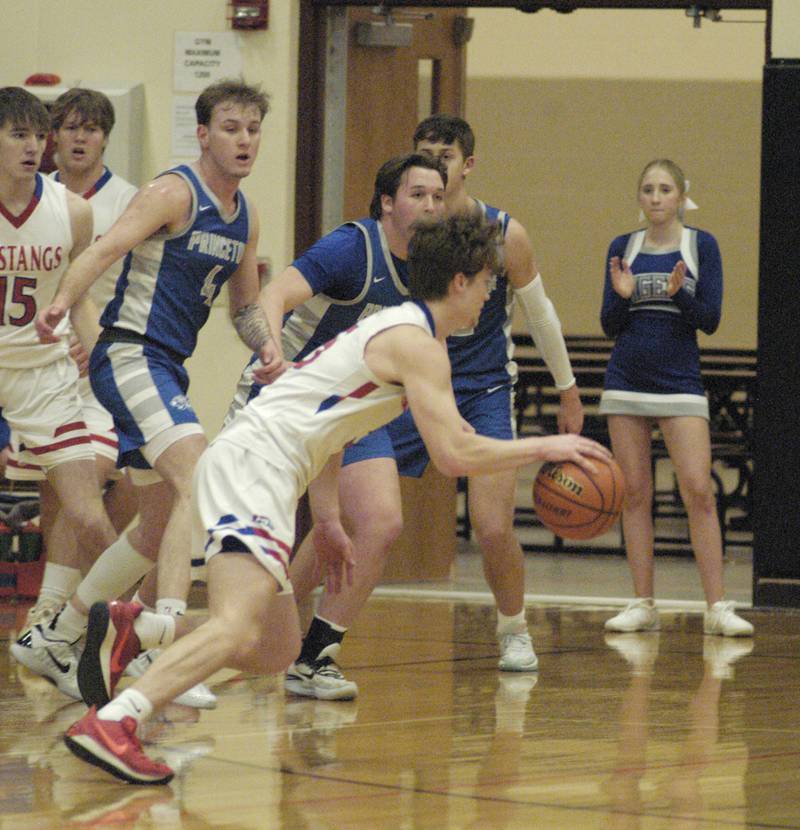 Morrison's Chase Newman drives towards the basket during the Morrison vs Princeton class 2A basketball regional final at Prophetstown High School on Friday, Feb. 23 .