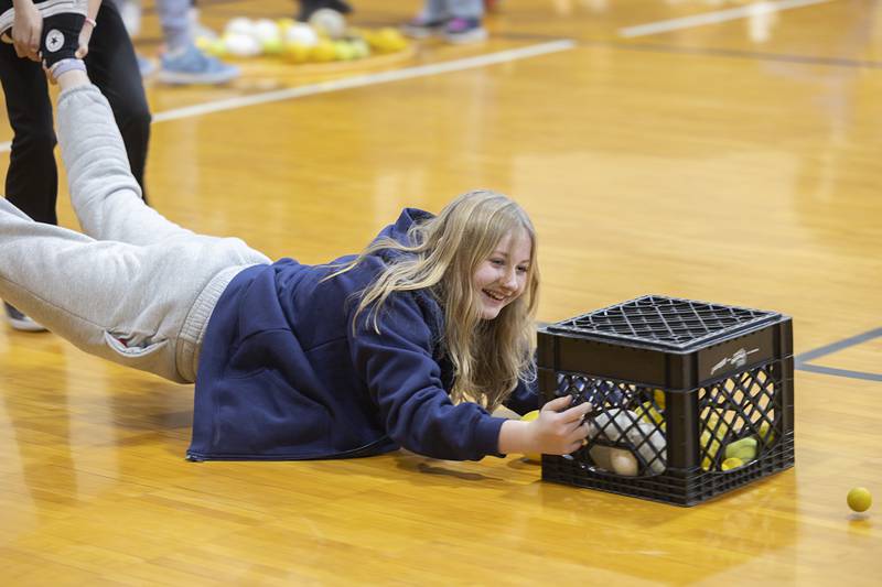 Eighth grader Jessica Ardis works the business end of an interactive “Hungry, Hungry Hippo” game at St. Mary’s School Thursday, Feb. 1, 2024 in Dixon. The students were treated to some fun in celebration of Catholic Schools Week.