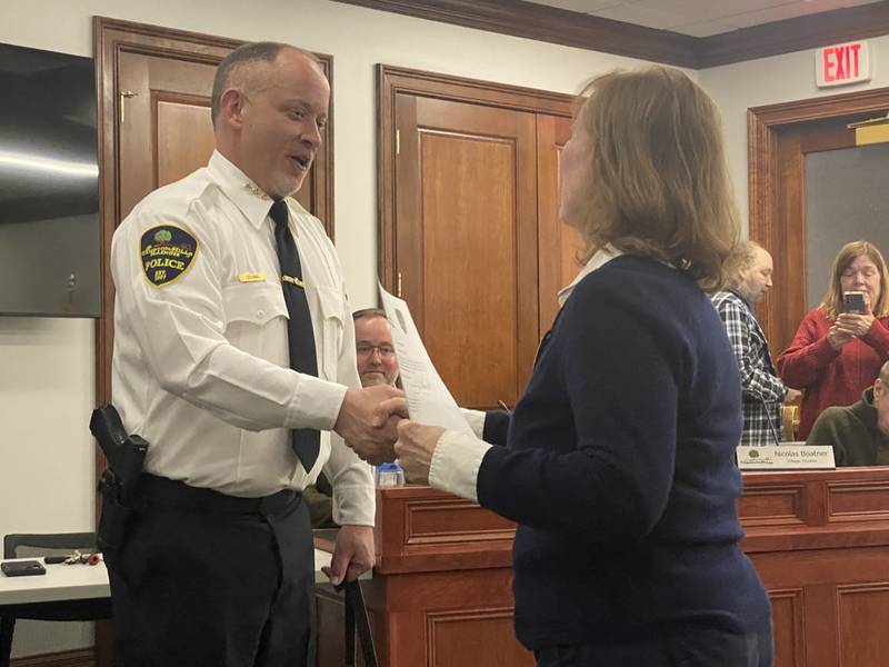 Campton Hills Village President Barbara Wojnick swears in James Levand as the village's new police chief on Feb. 20, 2024. Levand had been interim chief since July.