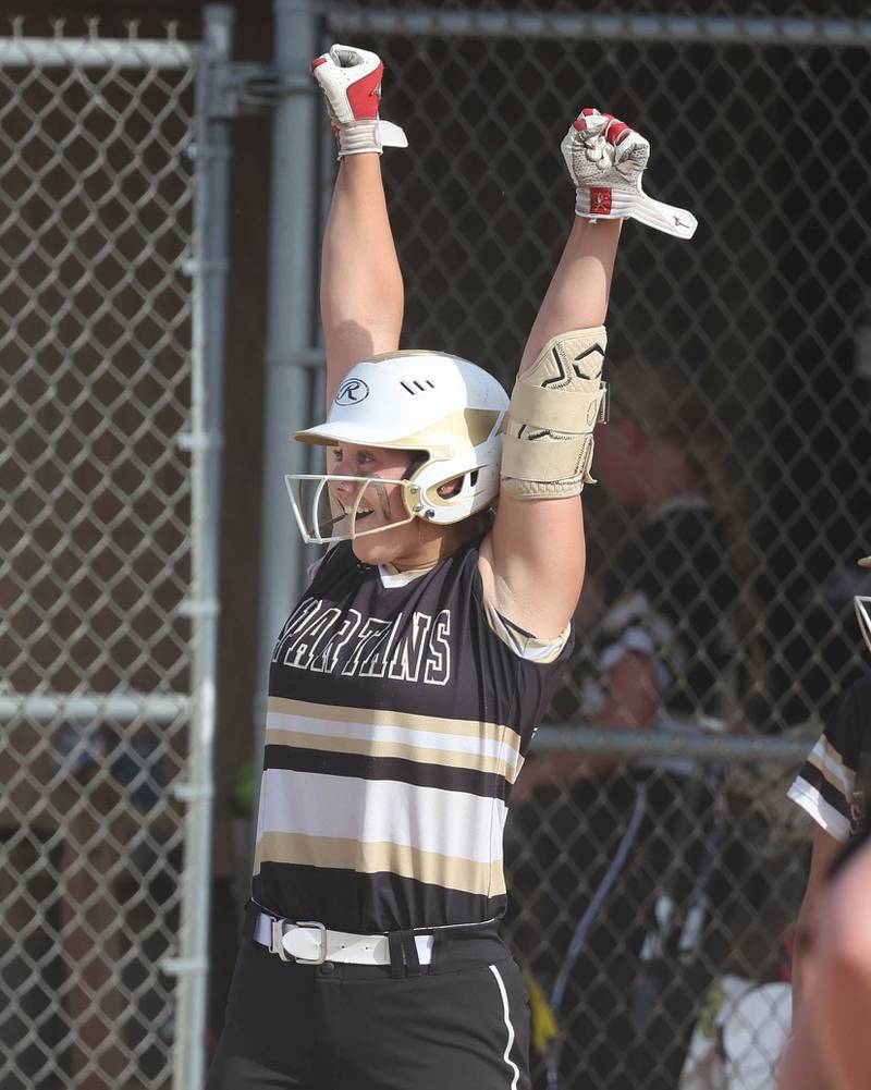 Sycamore's Kairi Lantz celebrates after a base hit during their Class 3A sectional final against Prairie Ridge Friday, May 31, 2024, at Sycamore High School.