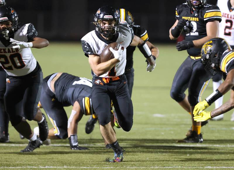 DeKalb's Talen Tate breaks through the Metea Valley defense for a touchdown during their game Friday, Sept 15, 2023, at Metea Valley High School in Aurora.