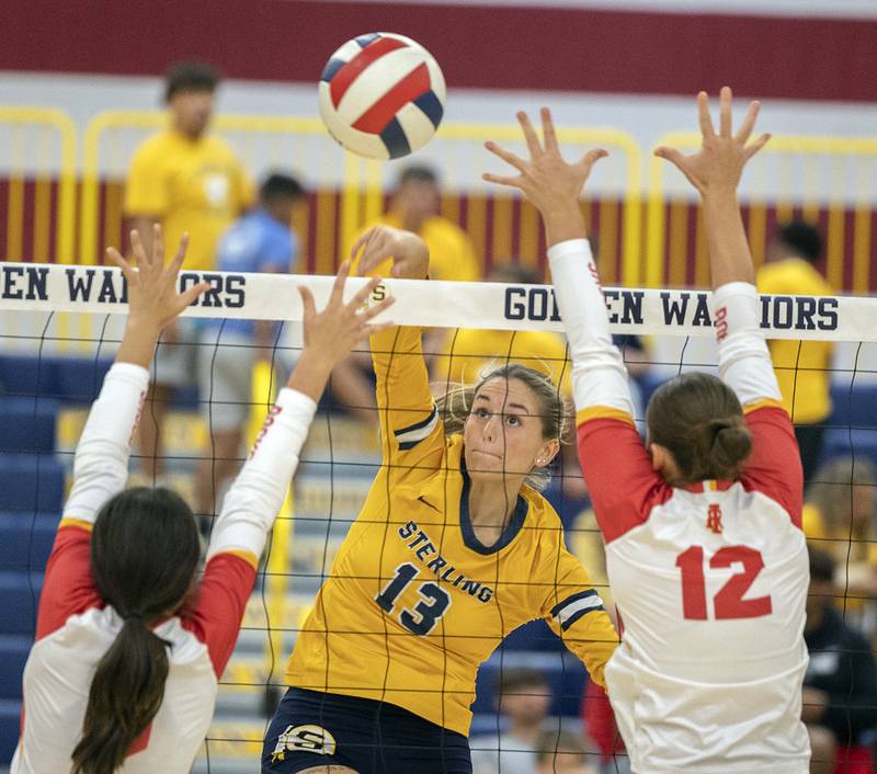 Sterling’s Marley Sechrest hammers a shot against Rock Island Tuesday, Sept. 17, 2024.