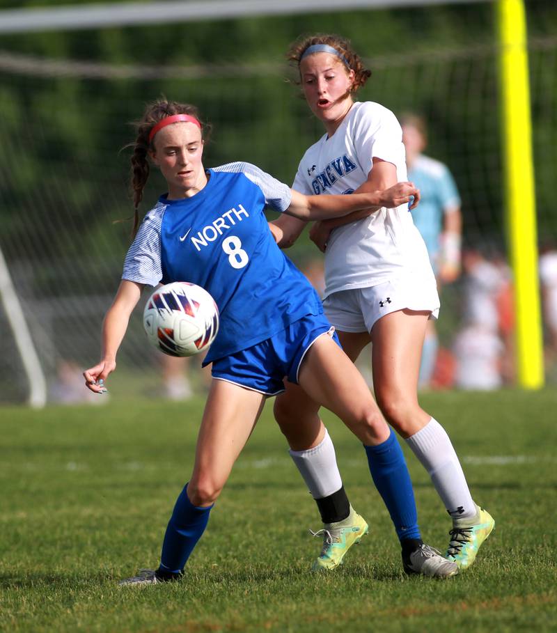 Wheaton North’s Jane Rogers gets the ball away from Geneva’s Caroline Madden during a Class 3A South Elgin Sectional semifinal game in May 2024.