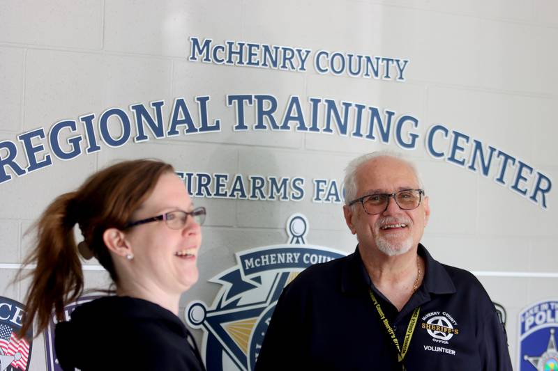 McHenry County Sheriff’s Office volunteers Brittany Rendant, left, and Brian Luczak visit during an open house at The McHenry County Regional Training Center in Cary Tuesday evening.