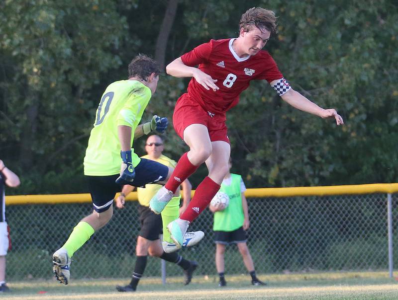 Streator's Noah Russow and Bloomington Central Catholic's keeper Emanuele Tameni leap in the air to go after  the ball on Wednesday, Aug. 23, 2023 at St. James Street Recreation Area in Streator.