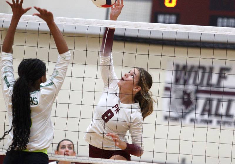 Prairie Ridge’s Brynn Palmer hits the ball against Crystal Lake South in varsity girls volleyball on Thursday, Aug. 29, 2024, at Prairie Ridge High School in Crystal Lake.