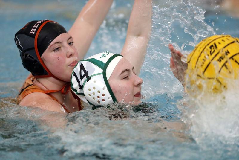 Hersey's Melissa Loch (4) tries to lock up YorkÕs Natalie Tuerk (14) during the IHSA State Water Polo consolation match Saturday May 20, 2023 at Stevenson High School in Lincolnshire.