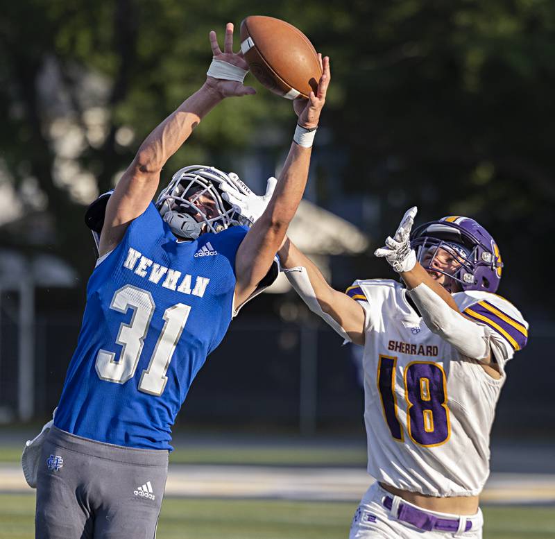 Newman’s Cody McBride picks off a pass in front of Sherrard’s Kyler Schmidt Saturday, Sept. 2, 2023 in a game at Sterling High School.