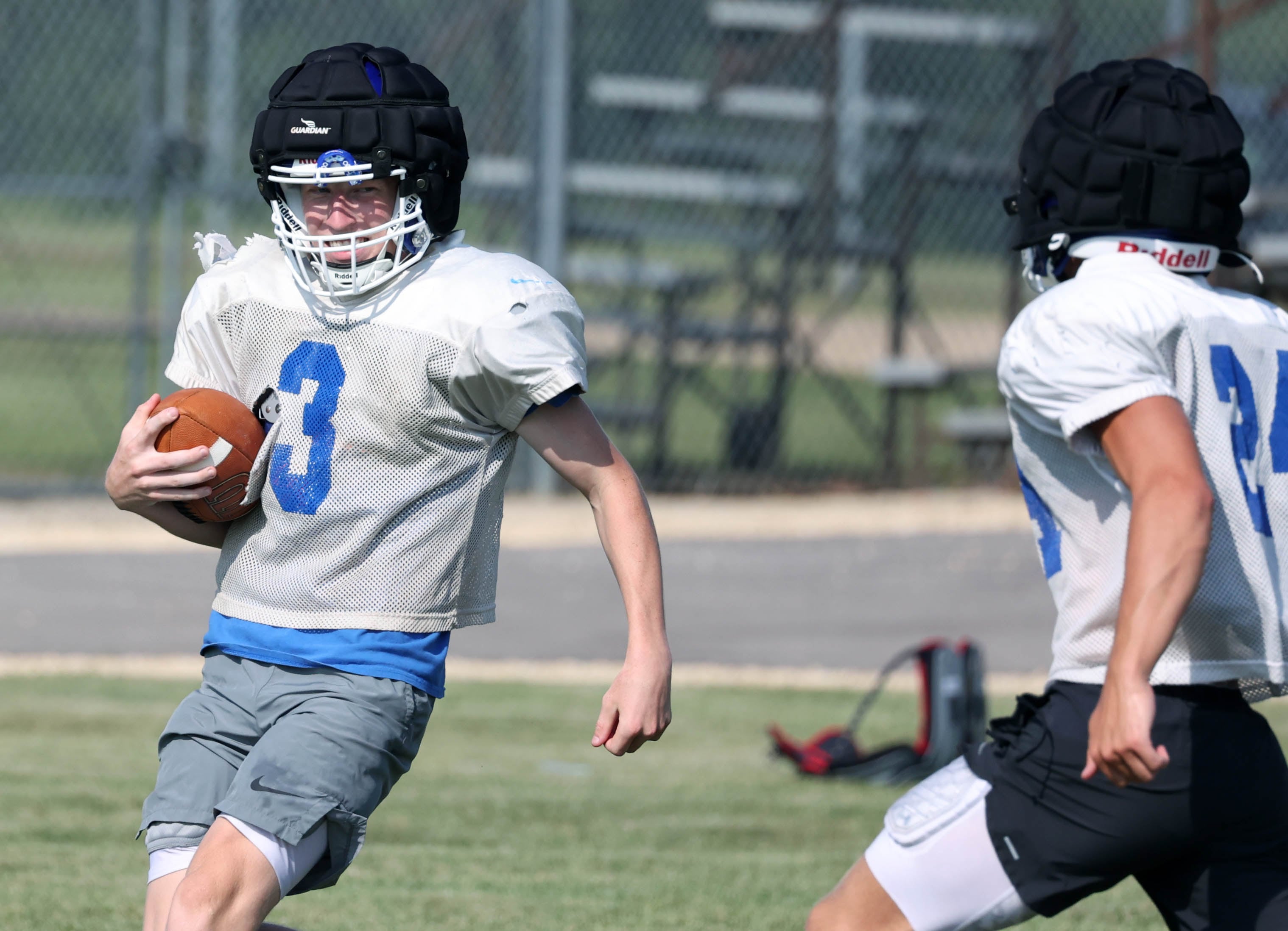 Genoa-Kingston’s Nolan Kline carries the ball during practice Wednesday, Aug. 14, 2024, at the school in Genoa.