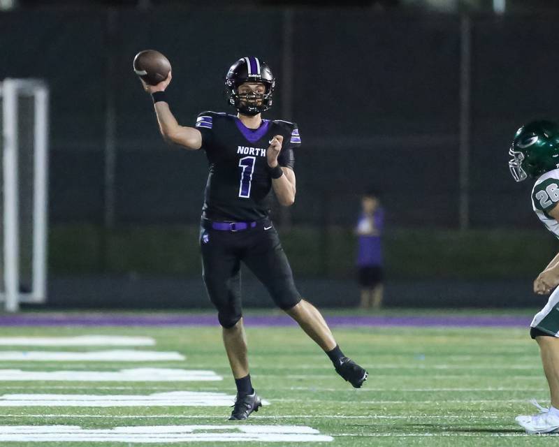 Downers Grove North's Owen Lansu (1) passes during a football game between Glenbard West at Downers Grove North on Friday, Sept 13th, 2024  in Downers Grove.