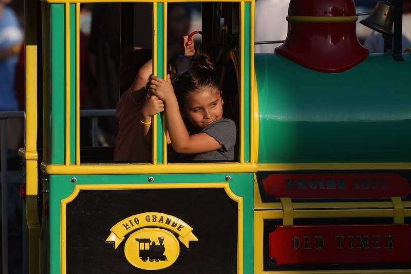 Elena Estrada enjoys a train ride at the Taste of Joliet on Friday, June 21, 2024 at Joliet Memorial Stadium.