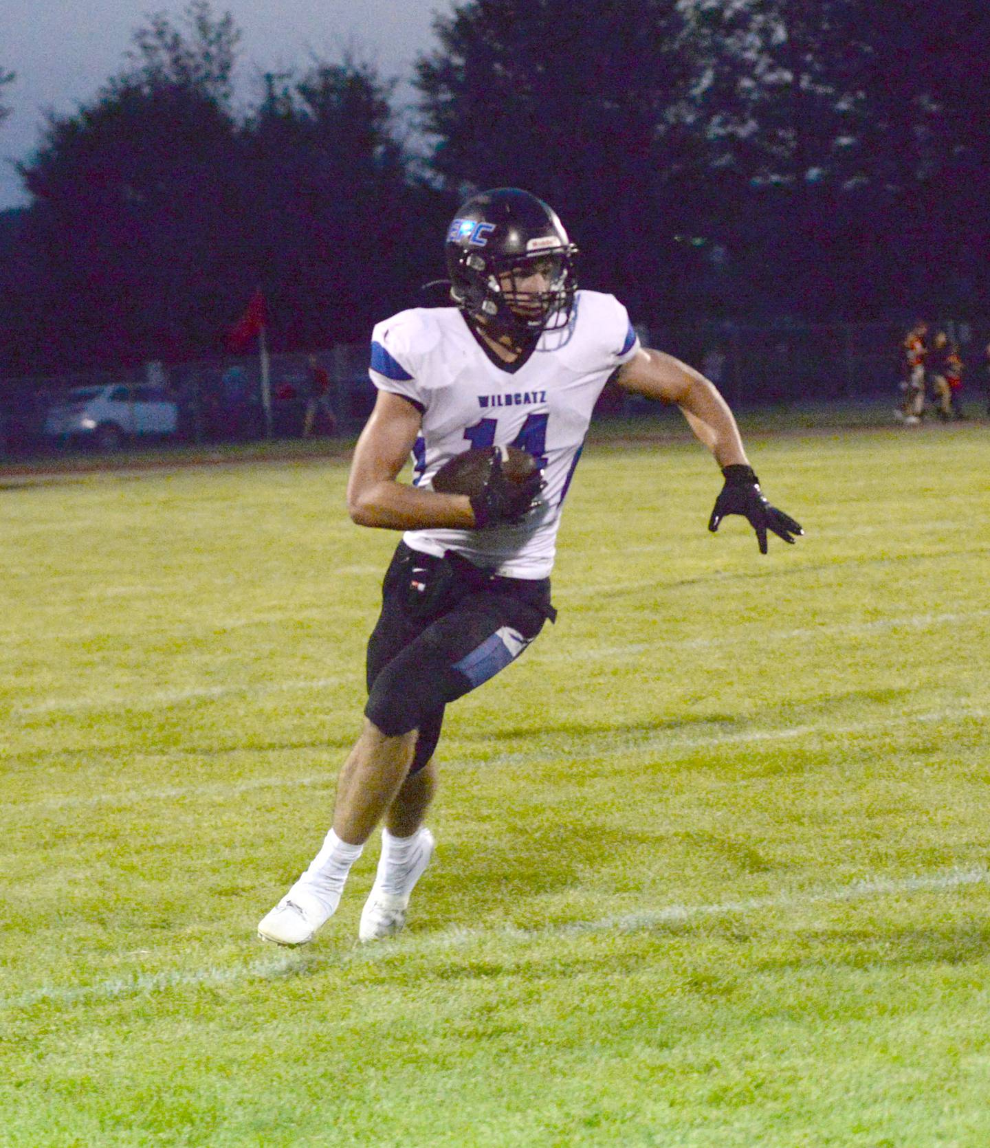 Eastland-Pearl City's Jaidyn McKinney (14) runs with the ball during a scrimmage at Landers-Loomis Field in Oregon on Friday, Aug. 23. 2024. The regular season begins Aug. 30 for area high school teams.