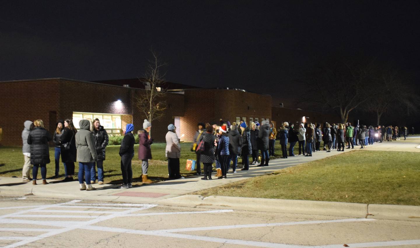More than 300 people attended a candlelight vigil on Tuesday, Dec. 14, 2021, outside Sycamore Middle School because the Sycamore Education Association and Sycamore School District 427 have still not yet agreed upon a contract. The contract expired July 31.