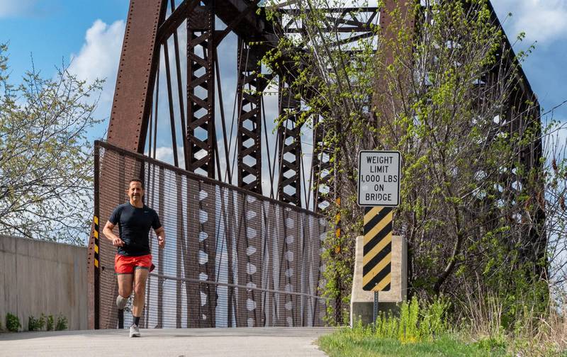 Wheaton resident Paul Mansour, who is running his 50th state marathon in Alaska in June, spends his mornings training on the Illinois Prairie Path.