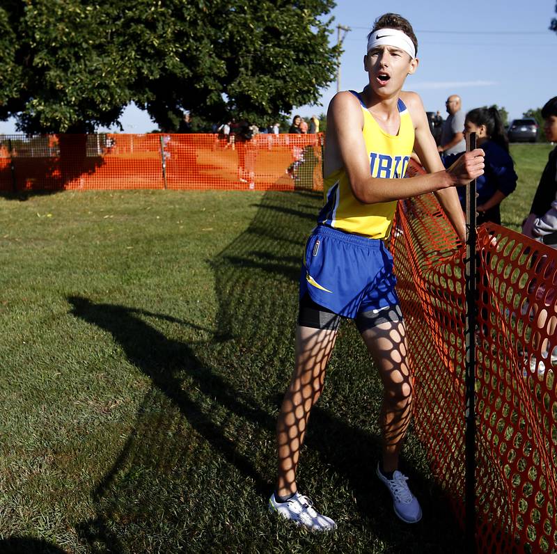 Johnsburg’s Jackson Batt catches his breath after competing in the boys race of the McHenry County Cross Country Meet Saturday, August 27, 2022, at Emricson Park in Woodstock.