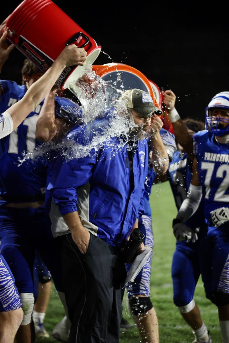 Princeton players douse coach Ryan Pearson after he recorded his 100th career win with Friday's 57-20 win over Mercer County at Bryant Field.