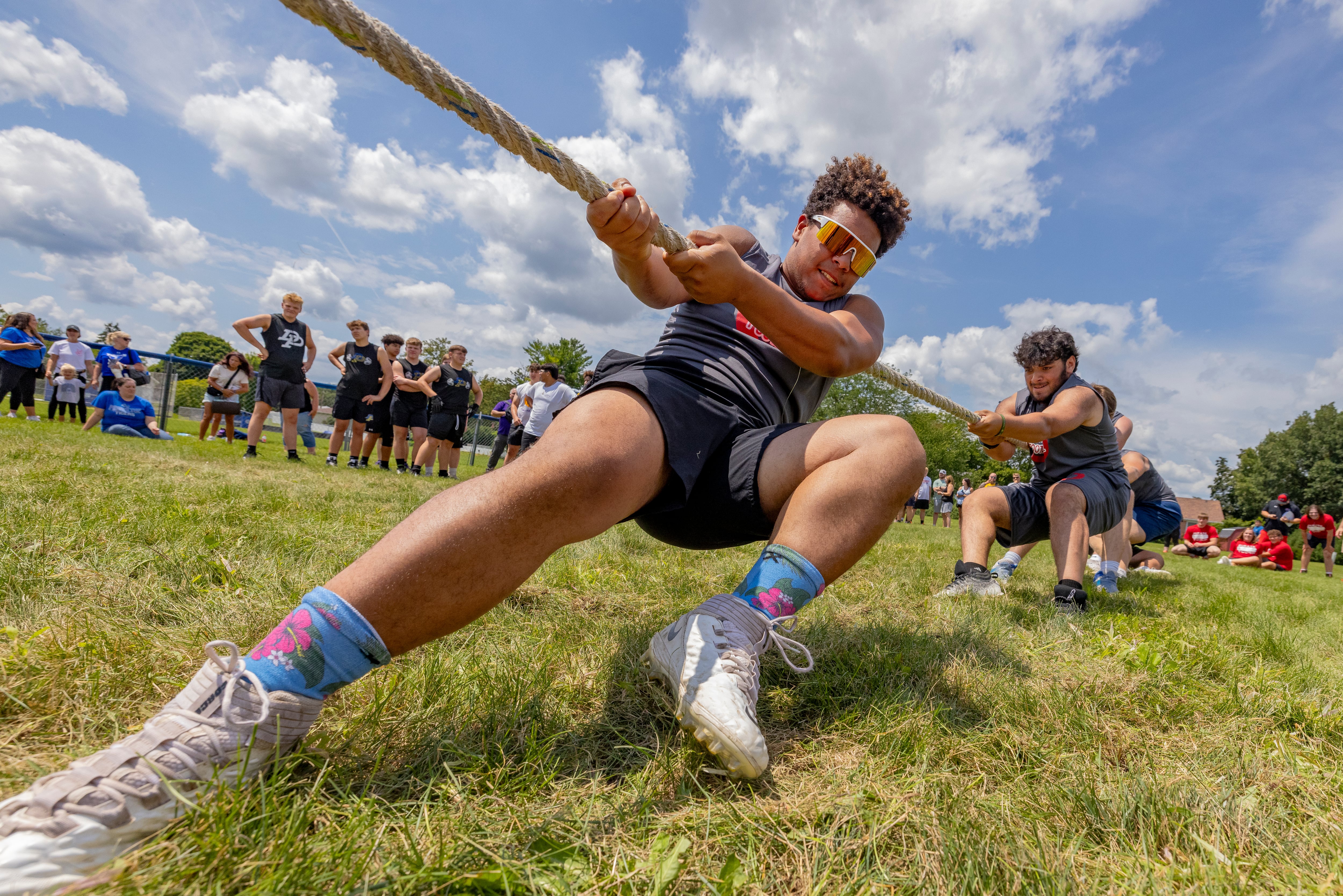 Players from Oregon High School compete in a tug of war during a multiple high school practice football meet at Princeton High School on July 20, 2024.