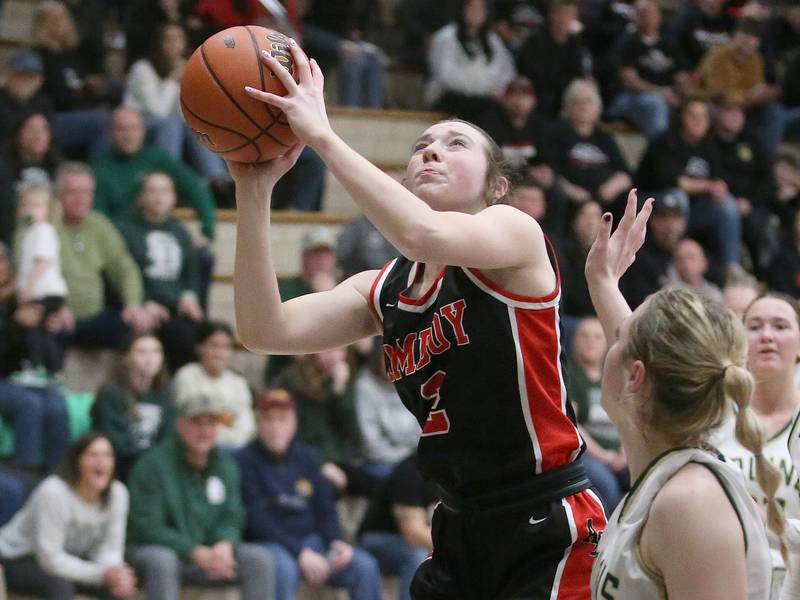 Amboy's Kiera Karlson eyes the hoop over St. Bede's Ashlyn Ehm during the Class 1A Regional final game on Friday, Feb. 16, 2024 at Marquette High School.