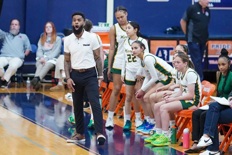 Waubonsie Valley's head coach Brett Love shouts instructions to his players during a Oswego semifinal sectional 4A basketball game against Downers Grove North at Oswego High School on Tuesday, Feb 20, 2024.