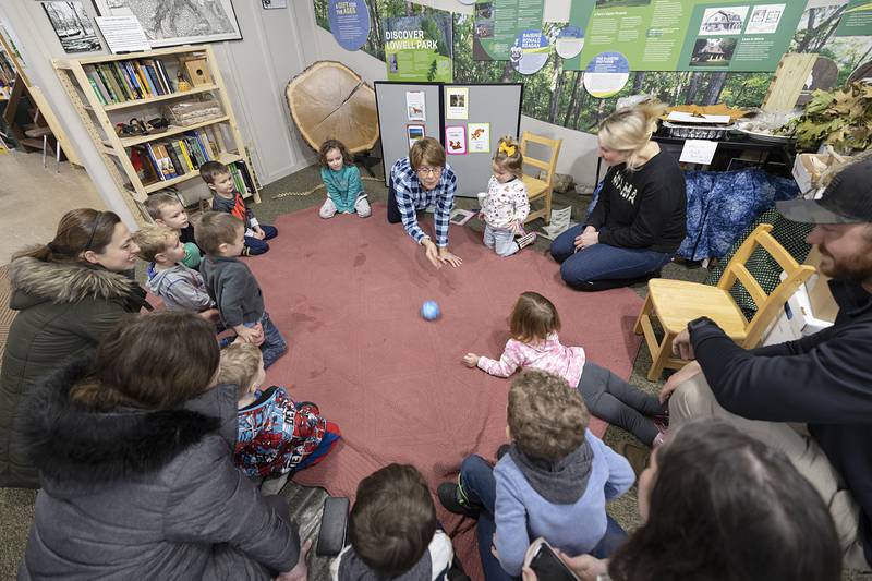 Kids form a circle before putting their pouncing skills to the test as a fox might while dining on a tasty mouse.