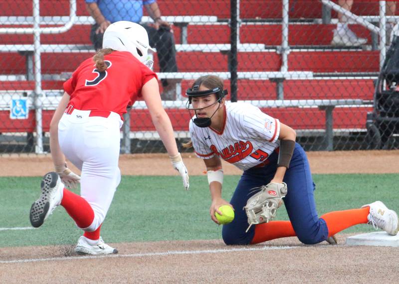 Oswego's Maddie Hernandez forces out Mundelein's Taylor Pyke after diving back to third base during the Class 4A third place game on Saturday, June 8, 2024 at the Louisville Slugger Sports Complex in Peoria.