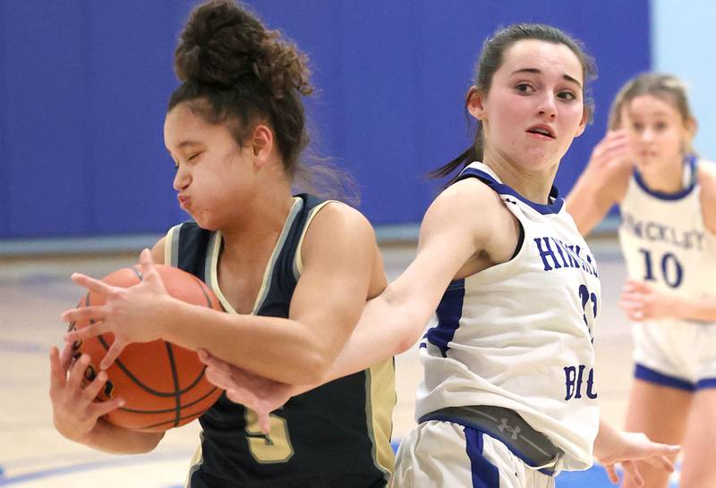 Harvest Christian’s Daphne Brown and Hinckley-Big Rock’s Mia Cotton go after a loose ball Monday, Jan. 8, 2023, during their game at Hinckley-Big Rock High School.