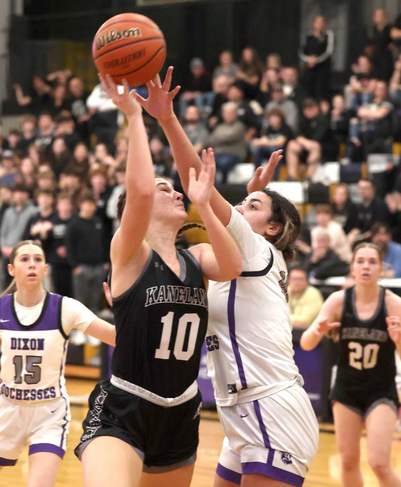 Kaneland's Emily Kunzer shoots over Dixon’s Hallie Williamson Thursday, Feb. 22, 2024, during their Class 3A sectional final game at Sycamore High School.