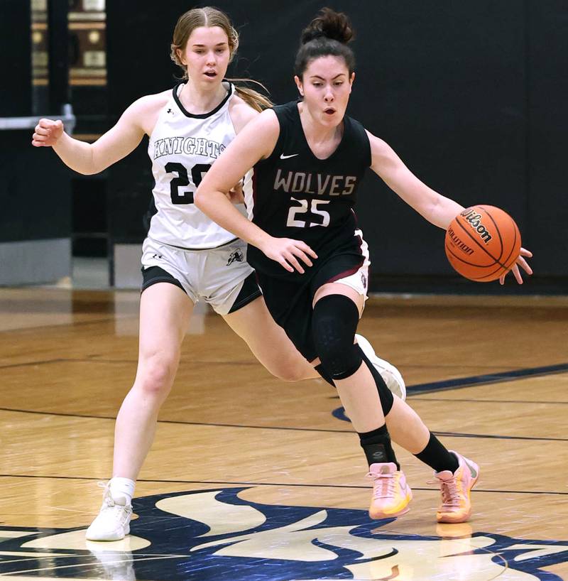 Prairie Ridge's Addie Meyer pushes the ball ahead of Kaneland's Sam Kerry Thursday, Feb 15, 2024, during their Class 3A regional final game at Kaneland High School in Maple Park.