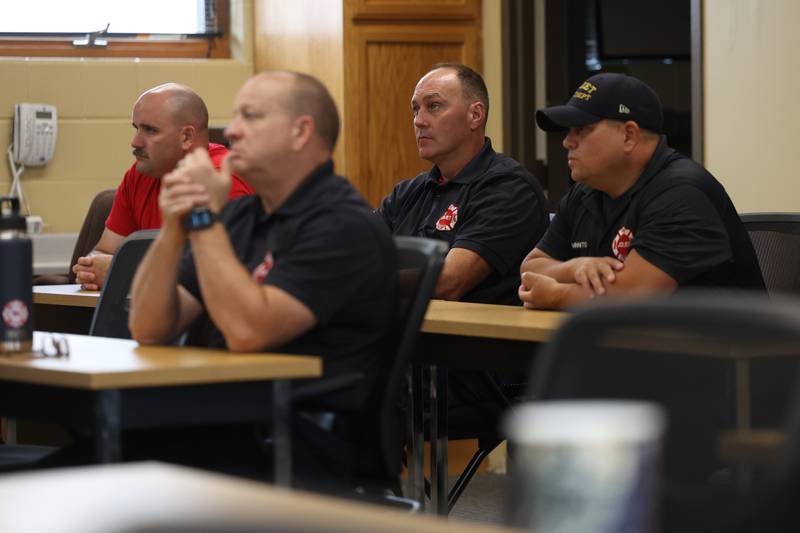 Joliet firefighters Robert Dempster, left, Mark Troha, Paul Purcell and Dominic Minnito sit in on a Crisis First Aid refresher course for the Joliet Fire Department Station One crew on Wednesday, July 12th, 2023 in Joliet.