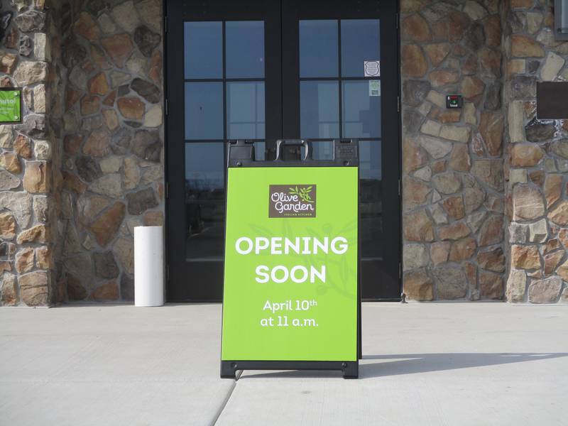 Sign outside the entrance of the soon-to-open Olive Garden Restaurant in Joliet marks the April 10 opening date. March 21, 2023.