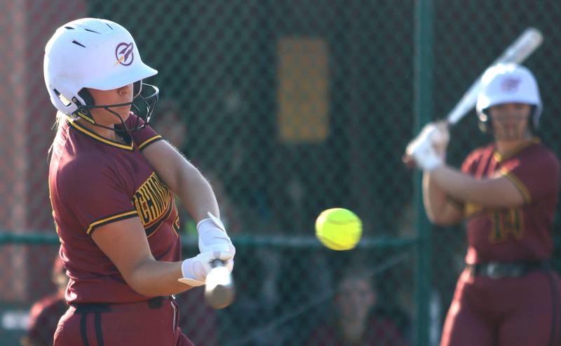 Richmond-Burton’s Madison Kunzer connects  in varsity softball at Marengo Monday.