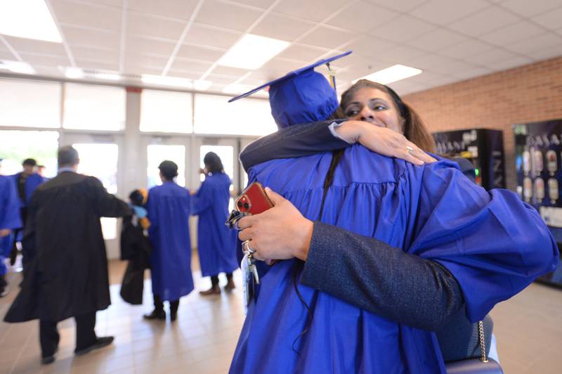Lyons Township English Alternative Program Teacher Antaash Safdar hugs some of her students including Jaia Tate of Summit prior to their graduation ceremony Wednesday May 29, 2024.